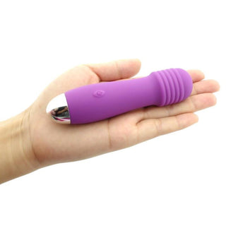 Featuring an image of Pocket Wand Mic Mini Wand Massager crafted from high-quality silicone and ABS for a soft touch.