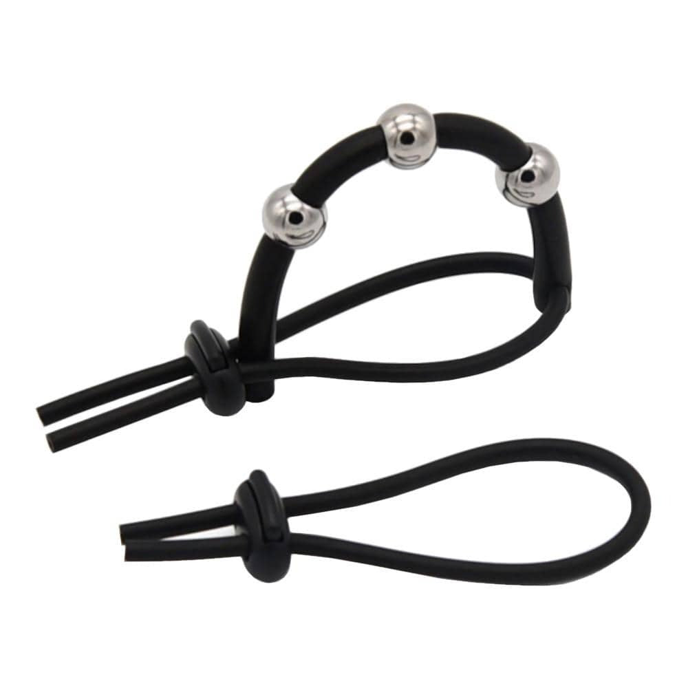 Displaying an image of a set of two silicone rings and a cable for electrostimulation, providing a tantalizing combination of pleasure and slight pain for an unforgettable experience.