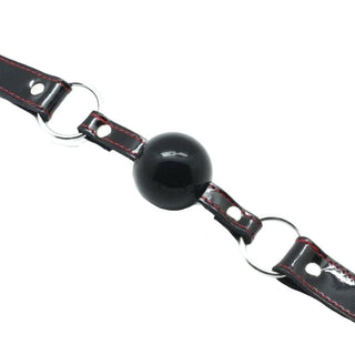 Observe an image of Drool Trainer Solid Rubber Ball Gag perfect size and fit.