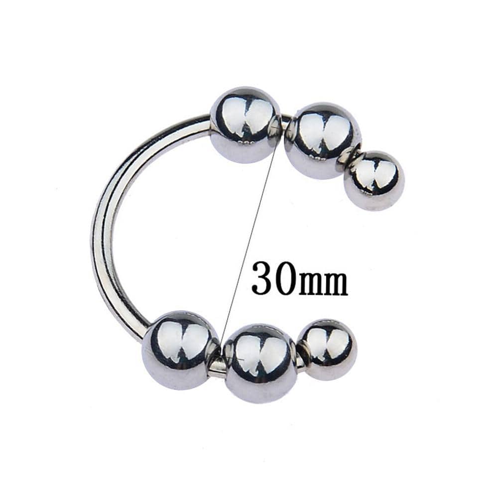 In the photograph, you can see an image of C-Shaped Beaded Stainless Glans Ring for safe and delightful experiences.