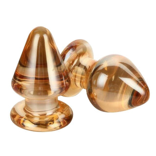 Displaying an image of Big and Chunky Golden Glass Plug 3.74 inches long with a sleek and tapered design.
