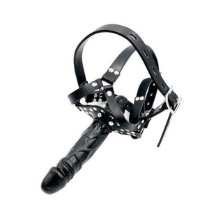 Displaying an image of Sadistic Open Mouth Gag Face Dildo with attached dildo and adjustable straps for submissiveness.