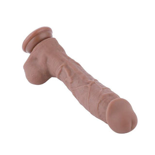 View of Girthy 10 Inch Bareskin Long Silicone Cyberskin Suction Cup Dildo in brown silicone for a realistic and body-safe experience.