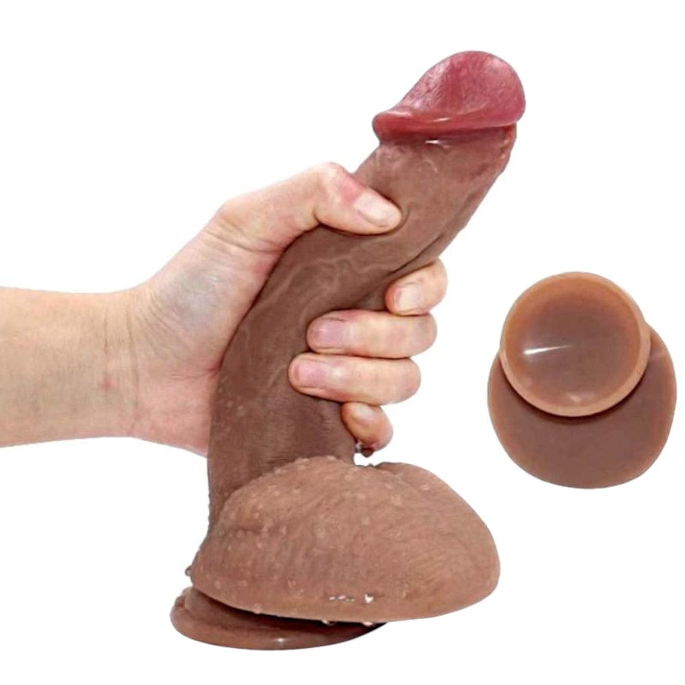 Featuring an image of Pegging Is Fun 7 Inch Dildo for Couples, highlighting its 1.38 inch width and dual-layer construction for a realistic feel.