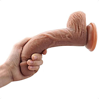 A picture of Pegging Is Fun 7 Inch Dildo for Couples, demonstrating its versatile use for both anal play and strap-on harness adventures.