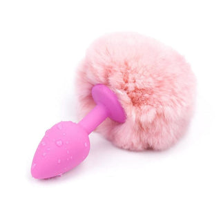 Vibrantly colored silicone tail plug 7 inches long in pink and black with faux fur tail 3.5 inches long.