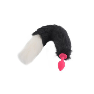 Check out an image of 18 Black With White Fox Tail Plug Silicone, featuring a plush black and white faux fur tail and high-quality silicone plug for thrilling intimate play.