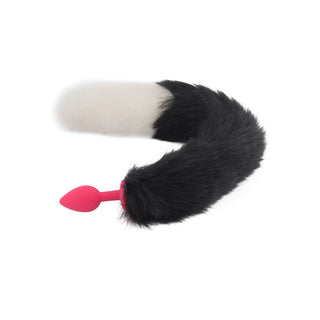 A visual of the 18 Black With White Fox Tail Plug Silicone, showcasing its impressive length and soft, skin-like texture for a comfortable experience.