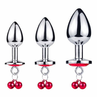 Observe an image of Dangling Jeweled Bell Princess Anal Trainer Set, 3-Piece showcasing the luxurious feel of the high-quality metal plugs against the skin.