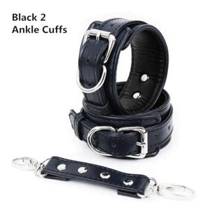 In the photograph, you can see an image of High End Ankle Cuffs in Leather, featuring adjustable belt-lock mechanism and D-ring for versatile play scenarios.