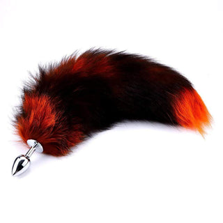Featuring an image of Racy Fox Tail Butt Plug 15-16 Inches Long, showcasing the vibrant black and orange tail swaying gracefully.