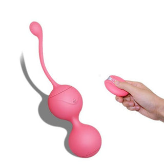 A close-up of medical silicone dual figure eight-shaped balls with remote control.