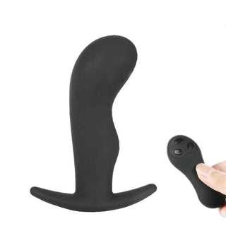 In the photograph, you can see an image of Remote Controlled Silicone Vibrating Butt Plug 4.33 Inches Long with remote control capability.