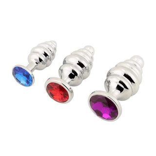 In the photograph, you can see an image of Silver Helix Cute Jeweled Anal Plug Big 3-Piece Set in various sizes and colors crafted from stainless steel.