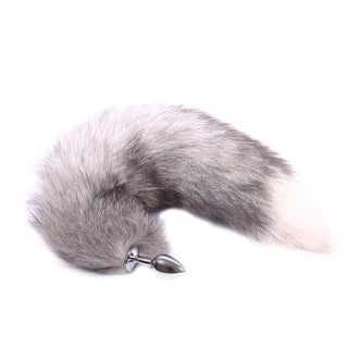 Soft gray and white faux fur tail with metallic plug in 3 sizes for comfortable and safe intimate adventures.