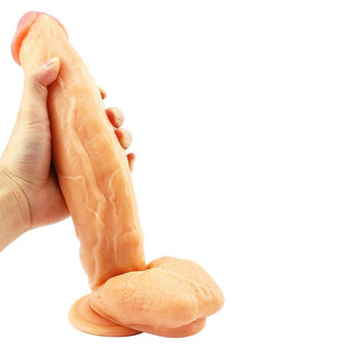 Presenting an image of a Flesh-colored 11.42-inch realistic dildo with a girthy shaft and a head designed for clitoral and G-spot stimulation.