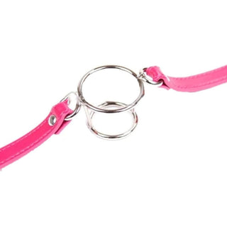 A picture of the Dual Ring Gag showcasing its synthetic leather straps and metal gag for comfort and safety.