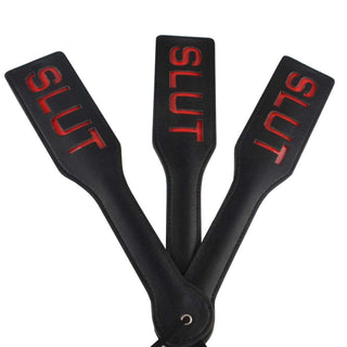 This is an image of SM Naughty Me Spanking Paddle, a luxury bondage tool made of PU leather.