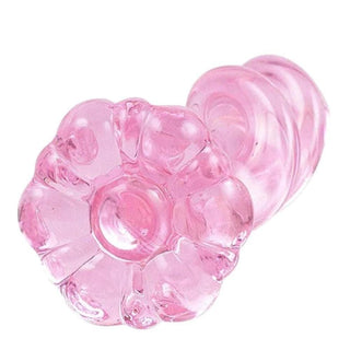 An image featuring the durable and hypoallergenic Pink Twirling Tower Prostate Stimulator Glass Anal Plug For Men 4.33 Inches Long, designed for comfort and safety.
