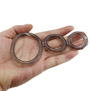 This is an image of transparent, purple, or black silicone triple rings designed for enhanced intimate moments and confidence boost.