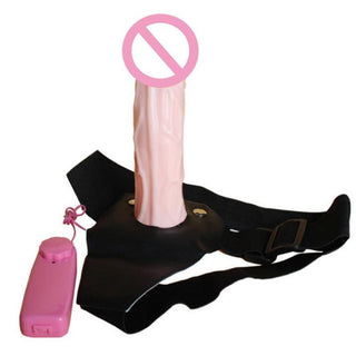 Realistic Vibrating Dildo With Harness in Black and Flesh colors, controlled by a Pink Remote.