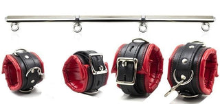 Feast your eyes on an image of Sadistic Kink Leather BDSM Adjustable Spreader Bar Strap with stainless steel bar and black and red PU leather cuffs.