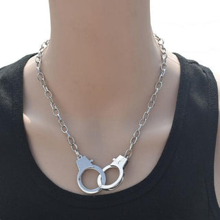 Take a look at an image of Cuffed for Life Permanent Collar Choker, a sleek iron collar with central cuffs for dominance and submission play.