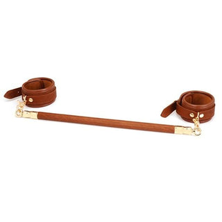 Here is an image of Super Fancy Strap Ankle Leather Bar With Cuffs, a luxurious bondage tool with sturdy metal bar and detachable leather cuffs.