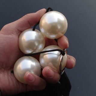 What you see is an image of Rear Entry Play Gold Anal Beads, a gold bead love tool designed for intense pleasure.