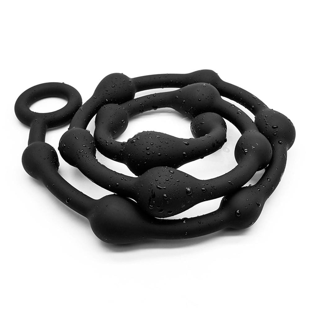 This is an image of Black Rangy Super Long String Balls, showcasing the stretchable loop base that doubles as a cock and ball ring.