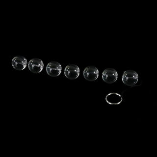 A detailed view of Clear Orbs Glass Anal Balls with a variety of sizes for personalized experiences.
