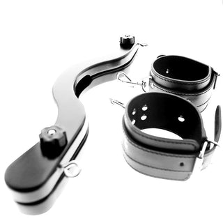 Quality craftsmanship in an image of Black CBT Humbler With Cuffs, composed of synthetic leather cuffs, metal clasps, plastic knobs, and a wooden humbler for maximum comfort and durability.