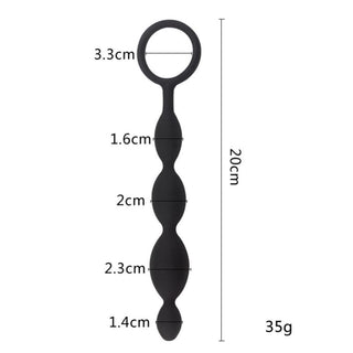Seven-point-eight-seven inches long Ebony Silicone Ass String Plug with tapered beads for progressive stimulation.