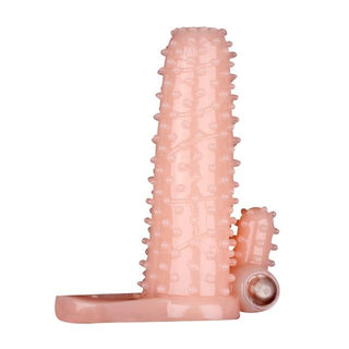 What you see is an image of Single-Frequency Hollow Vibrating Cock Sleeve Extender in flesh color for a natural appearance.