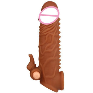 An image showcasing the 6.50-inch length and 1.58-inch width of Wild Sensations Vibrating Penis Extension in two stimulating textures.
