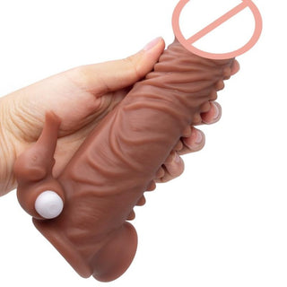A visual representation of the Horny Elephant Thick Vibrating Silicone Penis Extension, displaying its dimensions and intricate texture for enhanced pleasure.