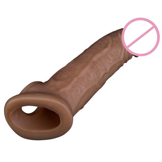 What you see is an image of Bigger Aspirations Thick Realistic Cock Sleeve Penis Extender with a realistic tip designed to delay climax for explosive release.