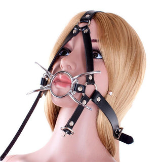 Explore the Spreader Spider Ring Gag with black and silver colors, designed for ultimate restraint and pleasure in bondage play.