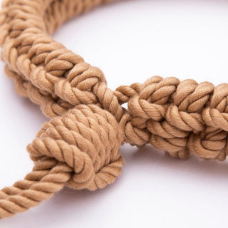 A detailed image of the comfortable grip and sensory experience provided by the blend of hemp, cotton, and silk in Slave Domination Beginner Silk Cotton Kinky Ankle Rope.