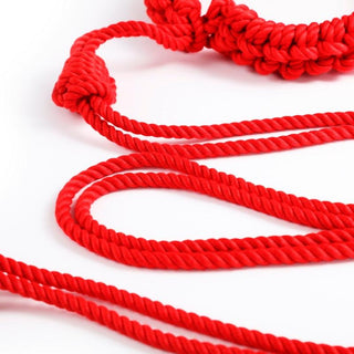 Feast your eyes on an image of the red and flaxen Slave Domination Beginner Silk Cotton Kinky Ankle Rope with versatile bondage possibilities.