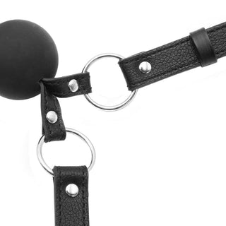 Liplock Bondage Double Ball Gag in black color with adjustable strap and tantalizing texture for thrilling play.