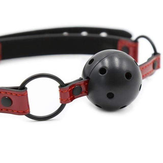 A close-up image of the adjustable strap and breathable gag of the Breathe Easy Gag Ball.