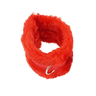 What you see is an image of Red Furry Sex Bed Restraints featuring plush synthetic fur-lined cuffs and D-ring for versatile play.