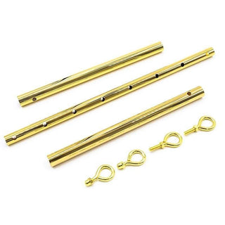 Observe an image of Gold Adjustable Bondage Spreader Bar with detachable bars and hooks for versatile configurations.