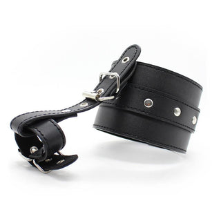 Take a look at an image of Thumb Locking BDSM Leather Sex Handcuffs for Play, durable handcuffs with belt-and-buckle system for secure fit.