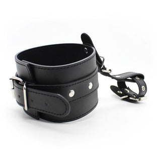 Thumb Locking BDSM Leather Sex Handcuffs for Play, adjustable wrist restraints with thumb slots in sleek black PU leather.