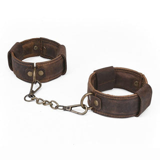 Pictured here is an image of Old School Genuine Leather Sex Cuffs with vintage design and detachable metal chains.