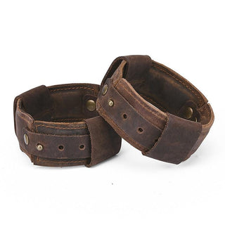 A close-up image of the genuine leather cuffs with 11-inch circumference and 5.50-inch chain length.
