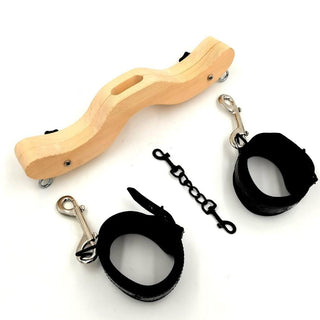 Ergonomic CBT wooden bondage toy with scrotal hole and adjustable cuffs for BDSM play.