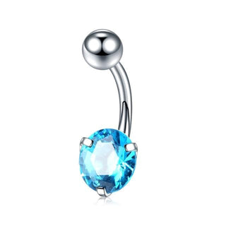 A picture of Zircon Crystal Clitoral Hood Piercing Jewelry featuring Peridot adornments